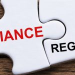 An Elevated View Of Compliance And Regulations Word Written On P